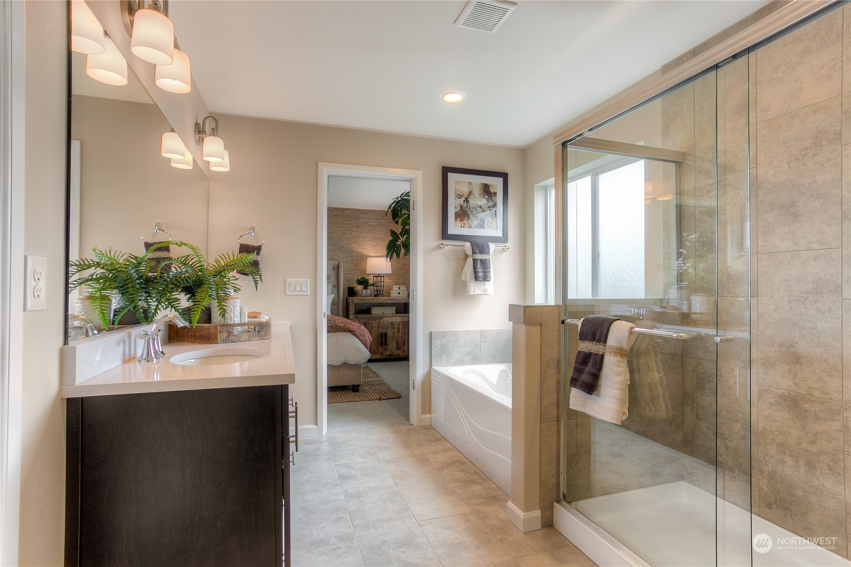 20828 42nd Drive Southeast, Unit 145 Bothell, WA 98021 - Photo 11 of 15 a bathroom with a tub sink and mirror