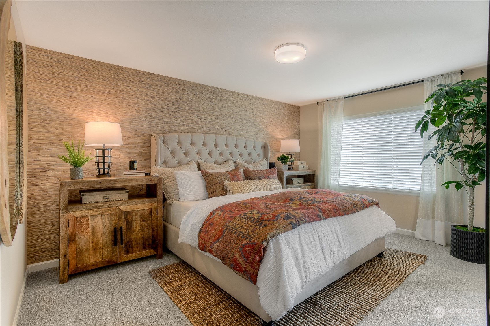 20828 42nd Drive Southeast, Unit 145 Bothell, WA 98021 - Photo 13 of 15 a bedroom with bed and a potted plant