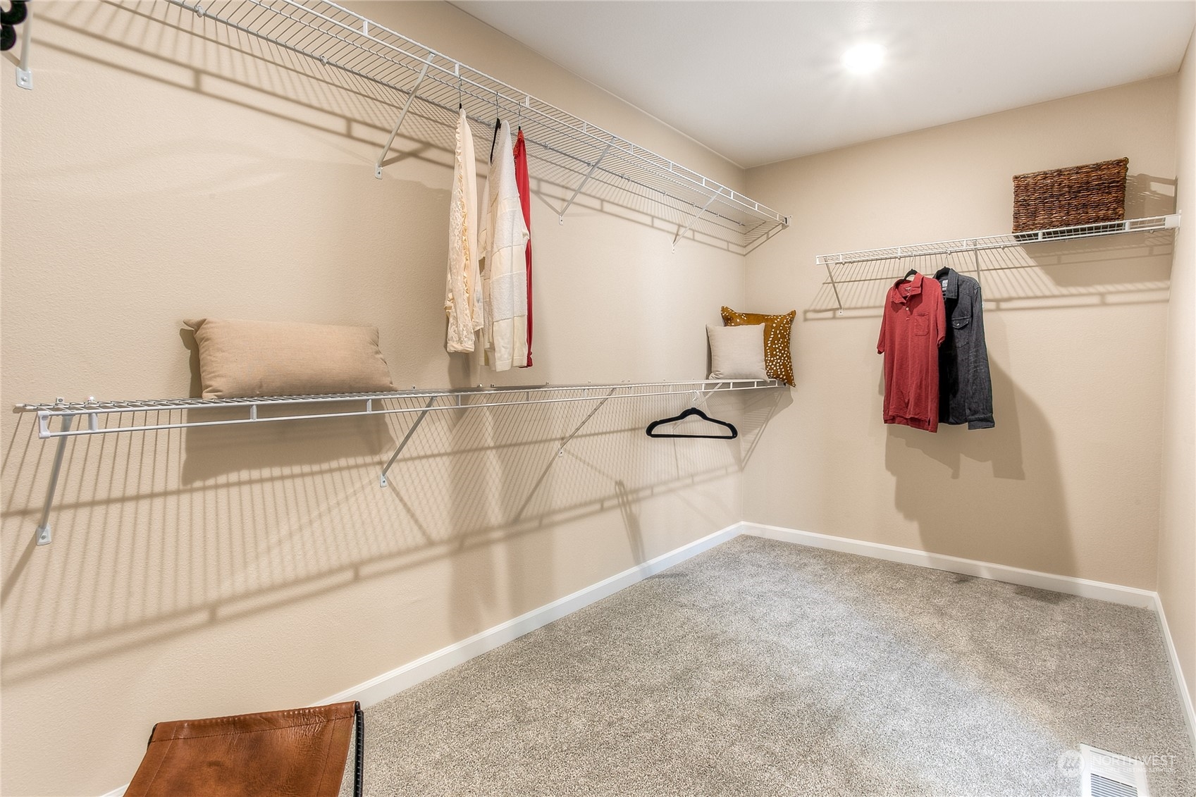 20828 42nd Drive Southeast, Unit 145 Bothell, WA 98021 - Photo 15 of 15 a view of walk in closet with clothes and shoes