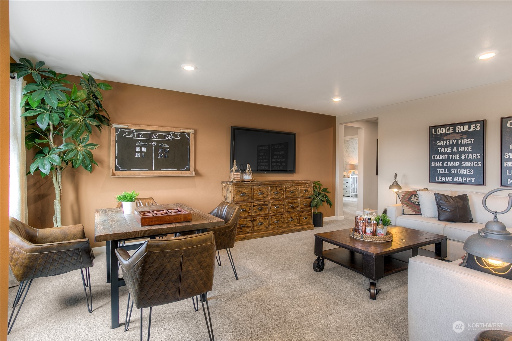 20828 42nd Drive Southeast, Unit 145 Bothell, WA 98021 - Photo 10 of 15 a living room with furniture and a flat screen tv