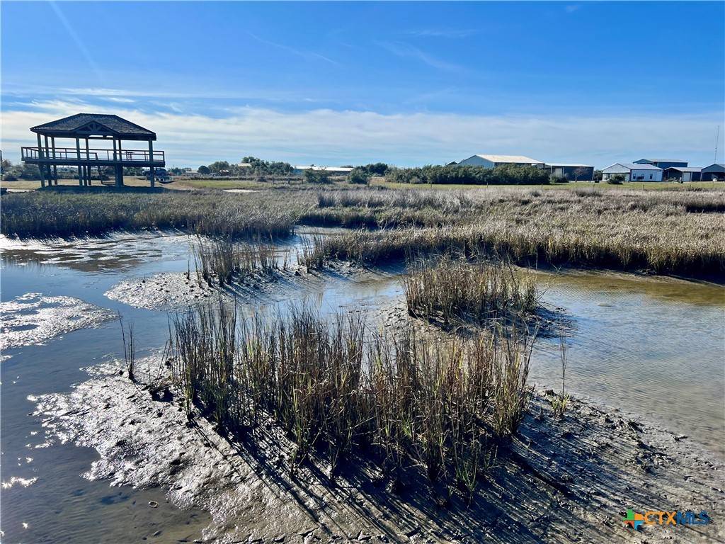 a view of a lake with beach and city view