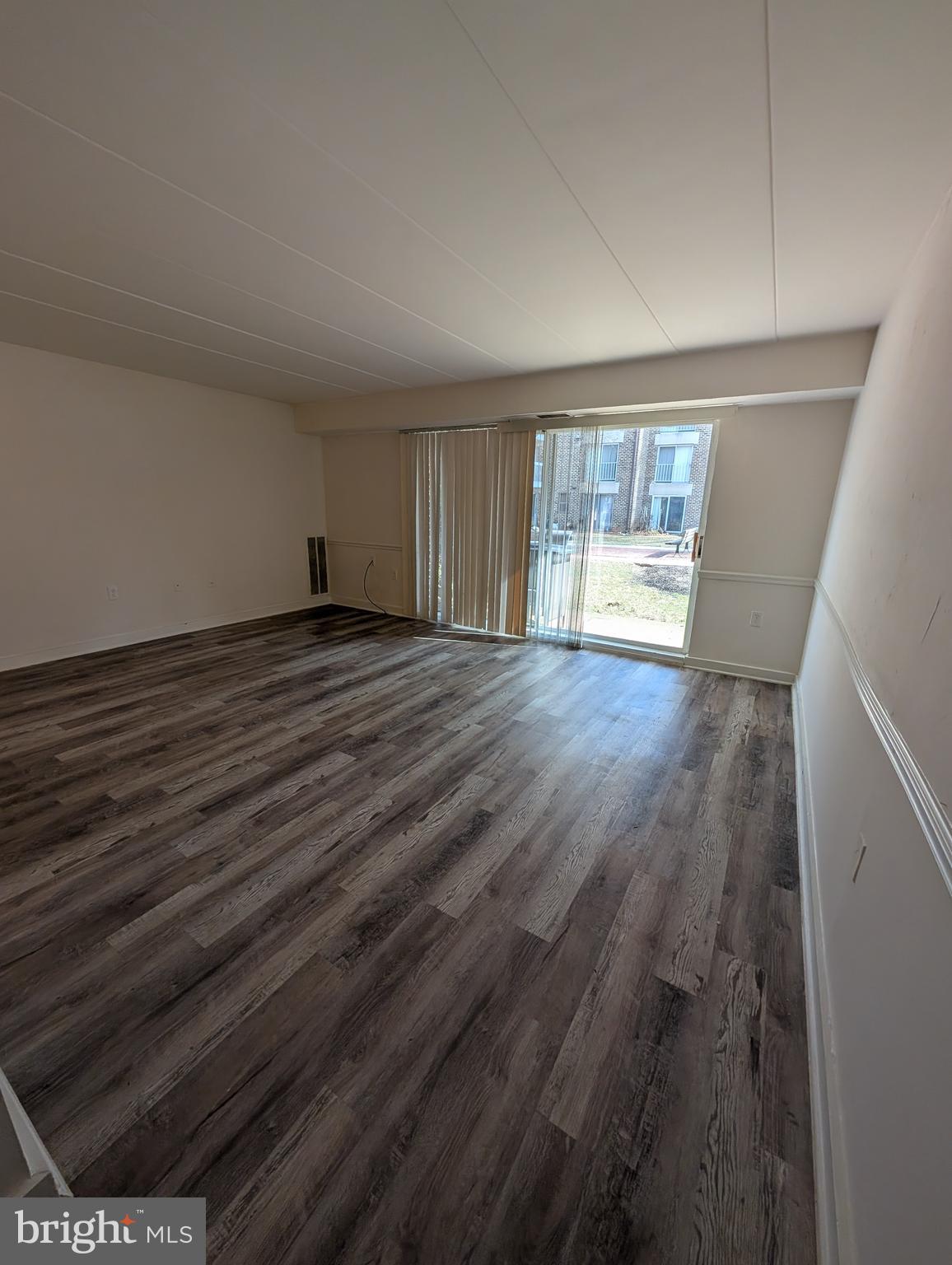 3320 Hewitt Avenue, Unit 52 Silver Spring, MD 20906 - Photo 6 of 23 living room with sliding doors to patio