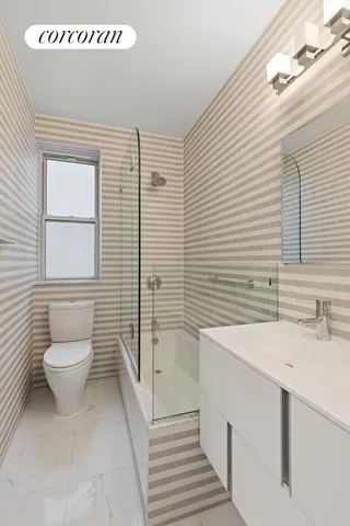 a kitchen with stainless steel appliances granite countertop white cabinets and a stove