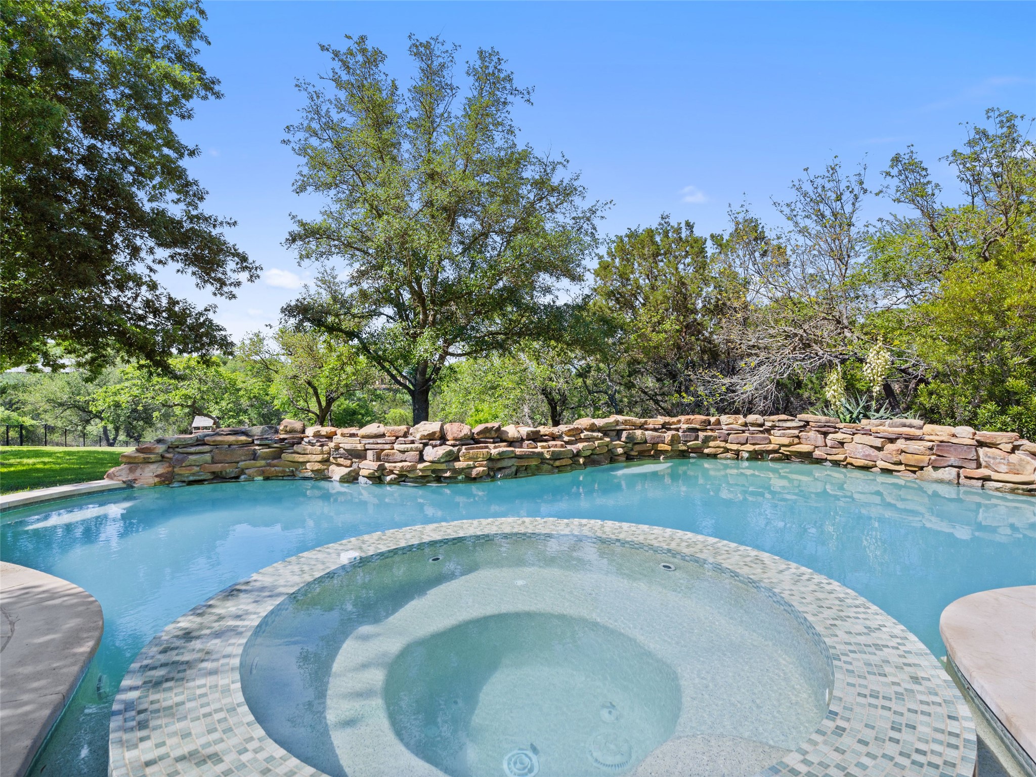 11620 Musket Rim Street Austin, TX 78738 - Photo 19 of 32 an outdoor view with swimming pool and outdoor space