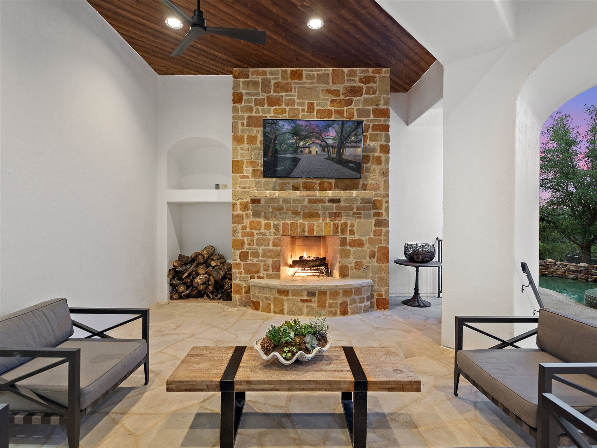 11620 Musket Rim Street Austin, TX 78738 - Photo 21 of 32 a living room with furniture and a fireplace