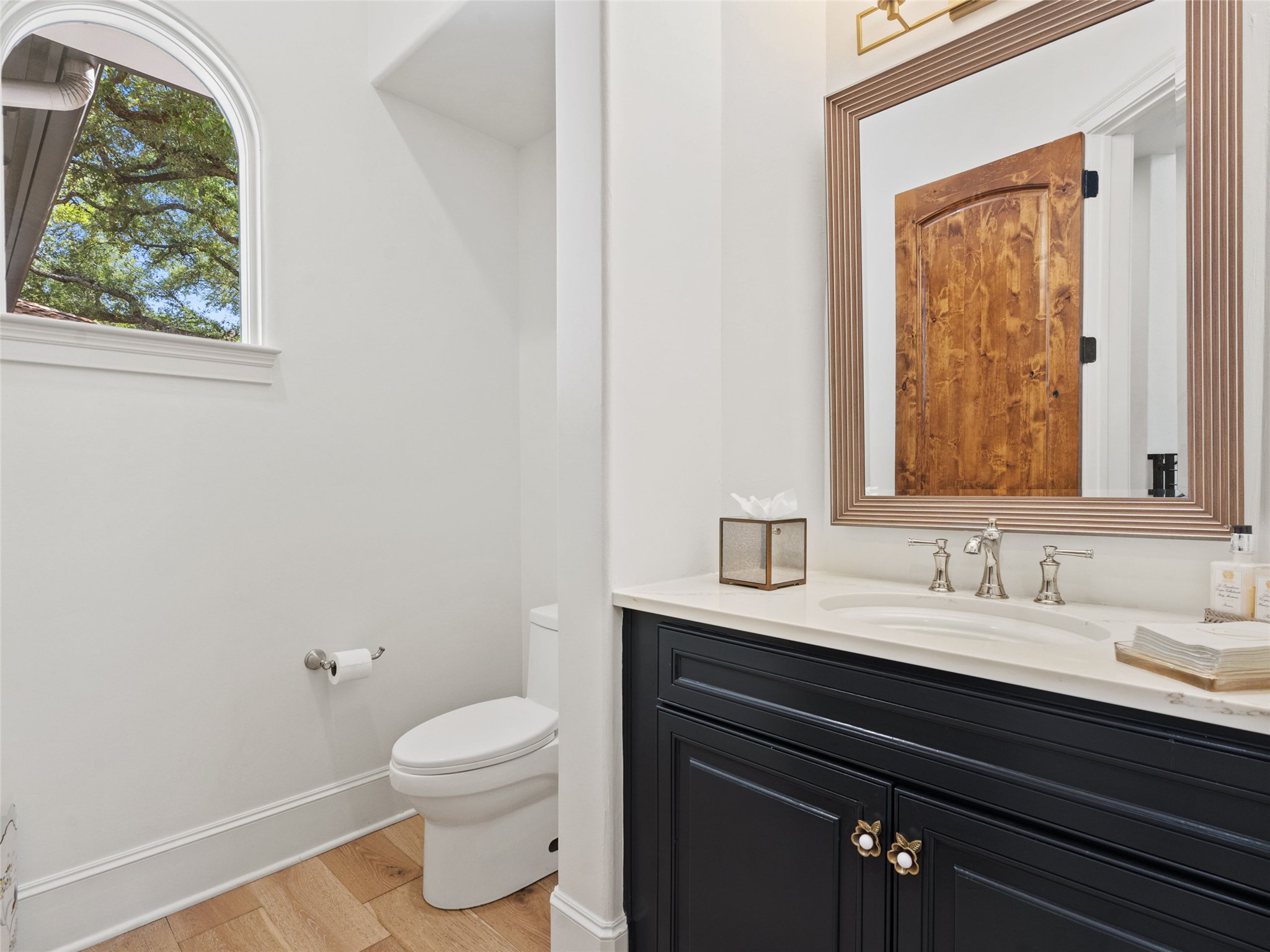 11620 Musket Rim Street Austin, TX 78738 - Photo 10 of 32 a bathroom with a granite countertop toilet sink and mirror
