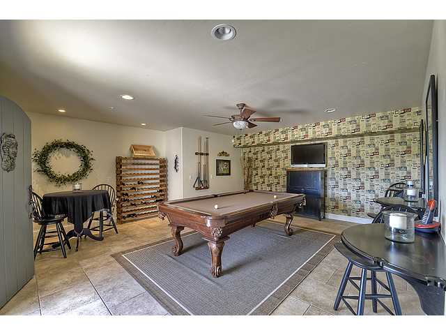 1035 Sleeping Indian Road Oceanside, CA 92057 - Photo 14 of 25 The studio is currently used as a game / wine room. There is also a HUGE extra storage area next to this room that goes under the home.