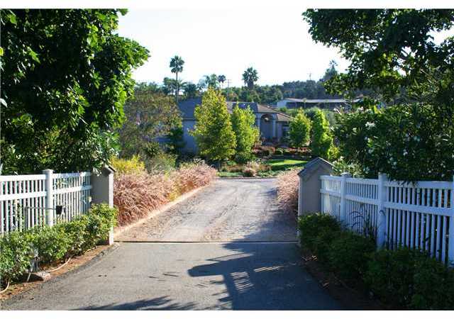 1035 Sleeping Indian Road Oceanside, CA 92057 - Photo 3 of 25 Past the gate is a crushed stone circular driveway leading up to this stunning custom 1-story home