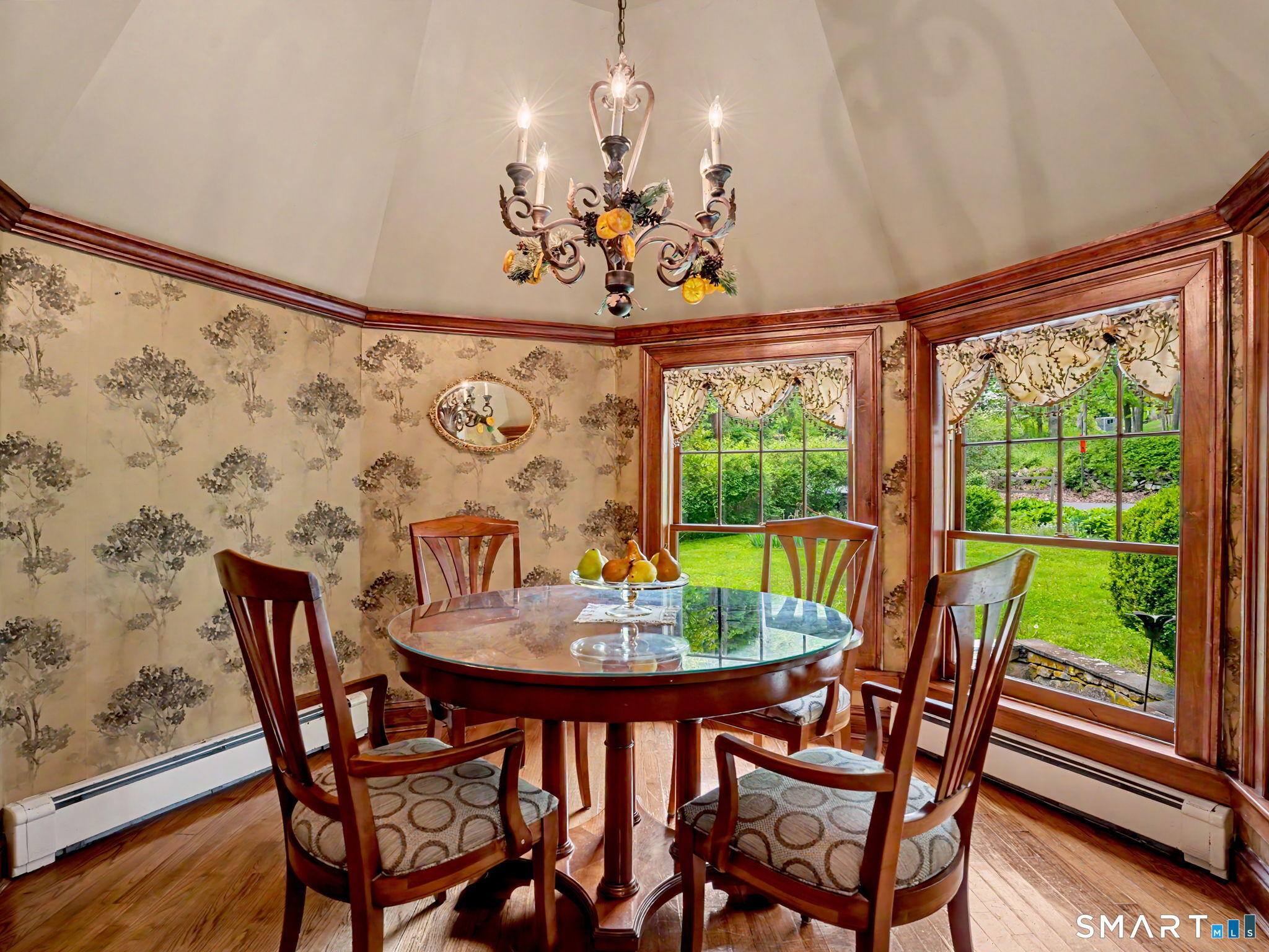 42 Cannondale Road Weston, CT 06883 - Photo 12 of 31 a view of a dining room with furniture a chandelier and wooden floor