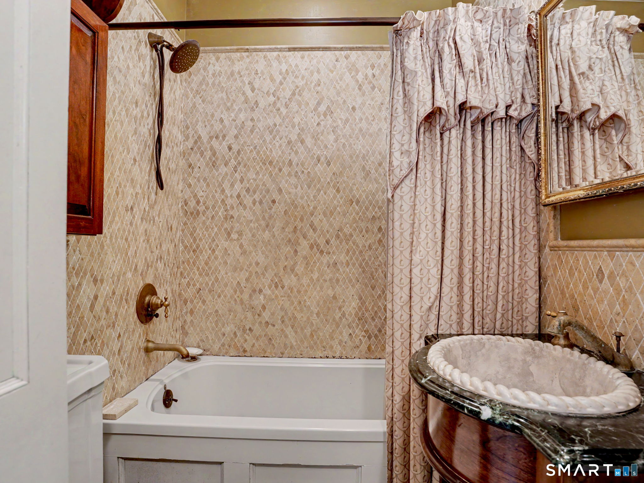 42 Cannondale Road Weston, CT 06883 - Photo 17 of 31 a bathroom with a sink and a toilet