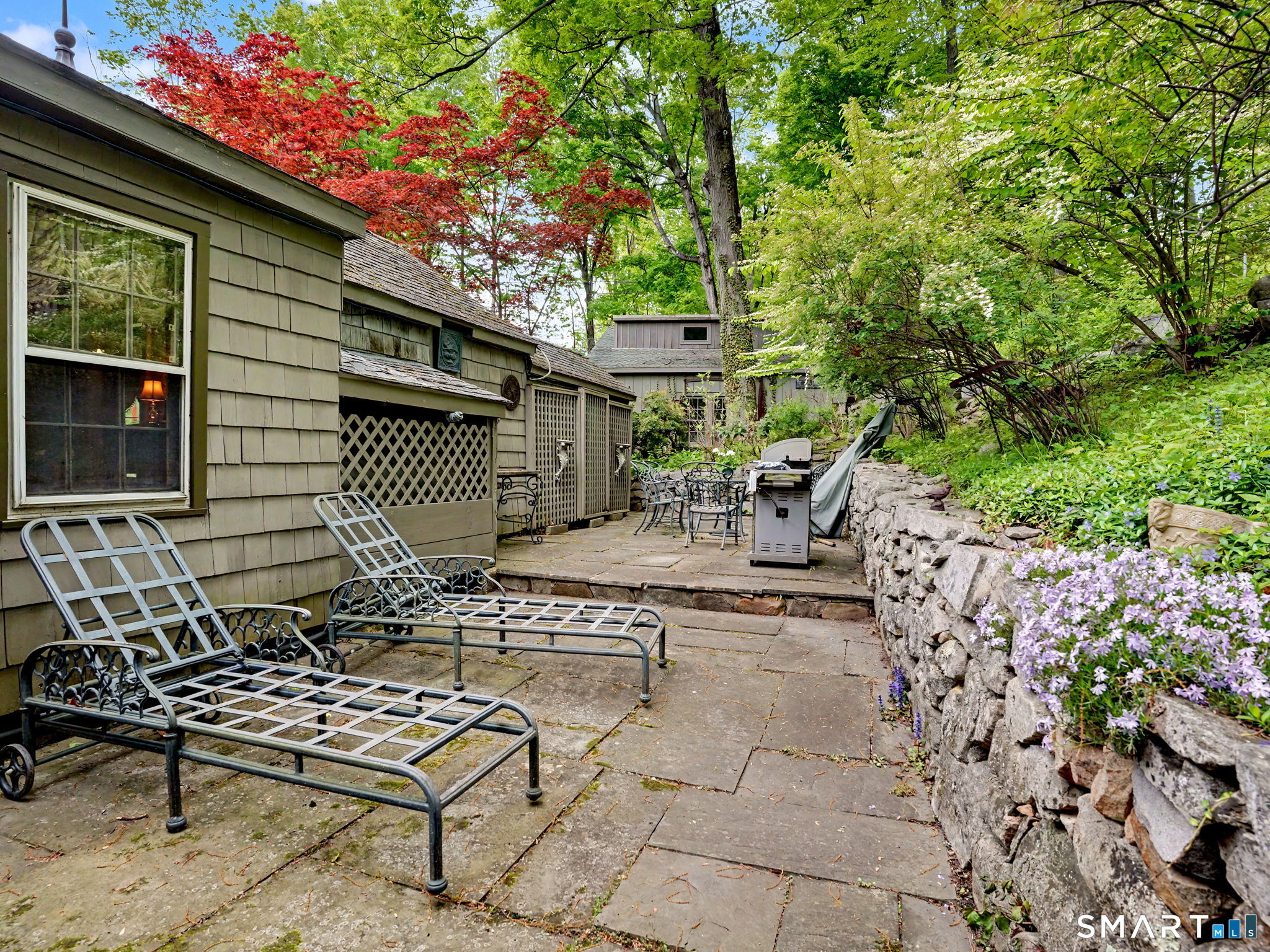 42 Cannondale Road Weston, CT 06883 - Photo 20 of 31 a view of a house with backyard and sitting area