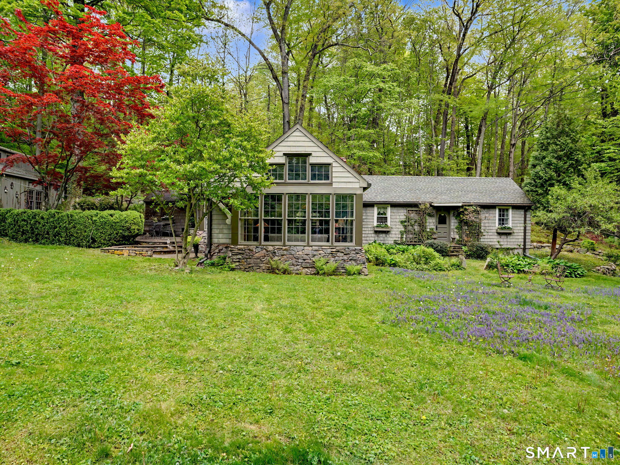 42 Cannondale Road Weston, CT 06883 - Photo 27 of 31 a front view of a house with a garden