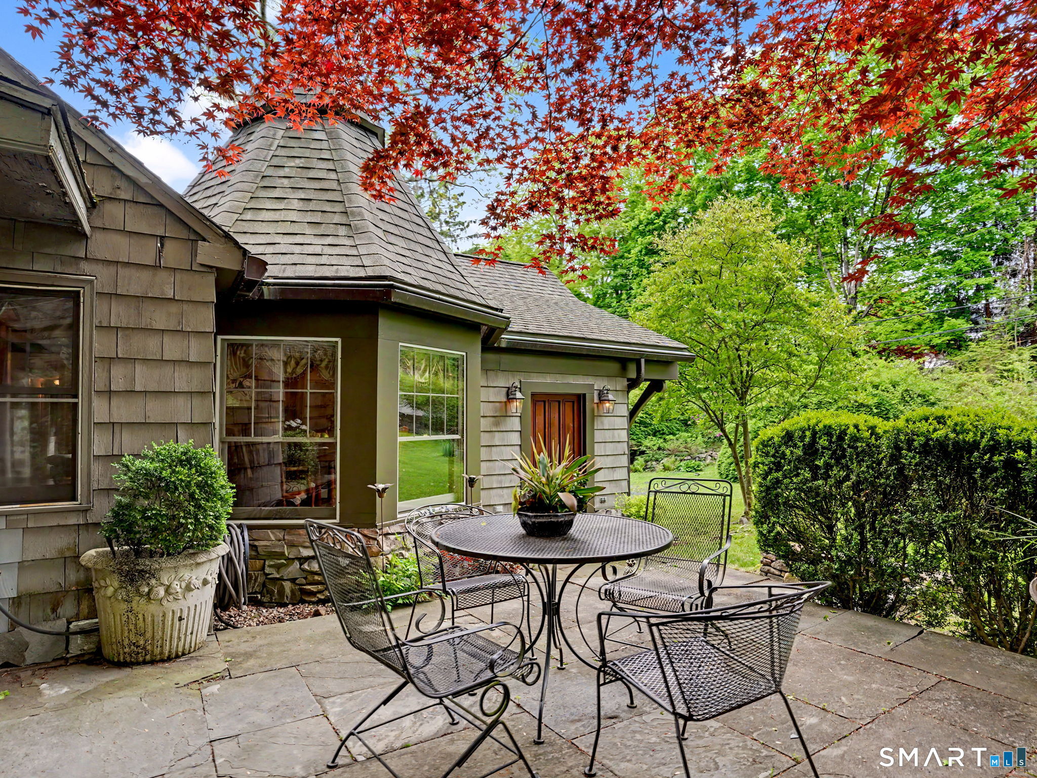 42 Cannondale Road Weston, CT 06883 - Photo 3 of 31 a backyard of a house with table and chairs