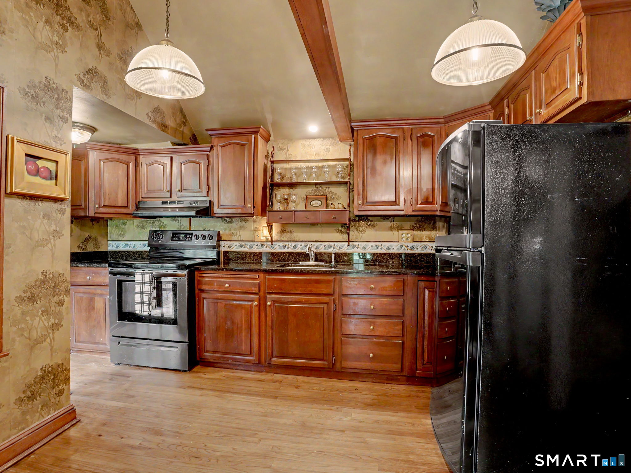 42 Cannondale Road Weston, CT 06883 - Photo 10 of 31 a kitchen with stainless steel appliances granite countertop a refrigerator a stove a sink and a microwave