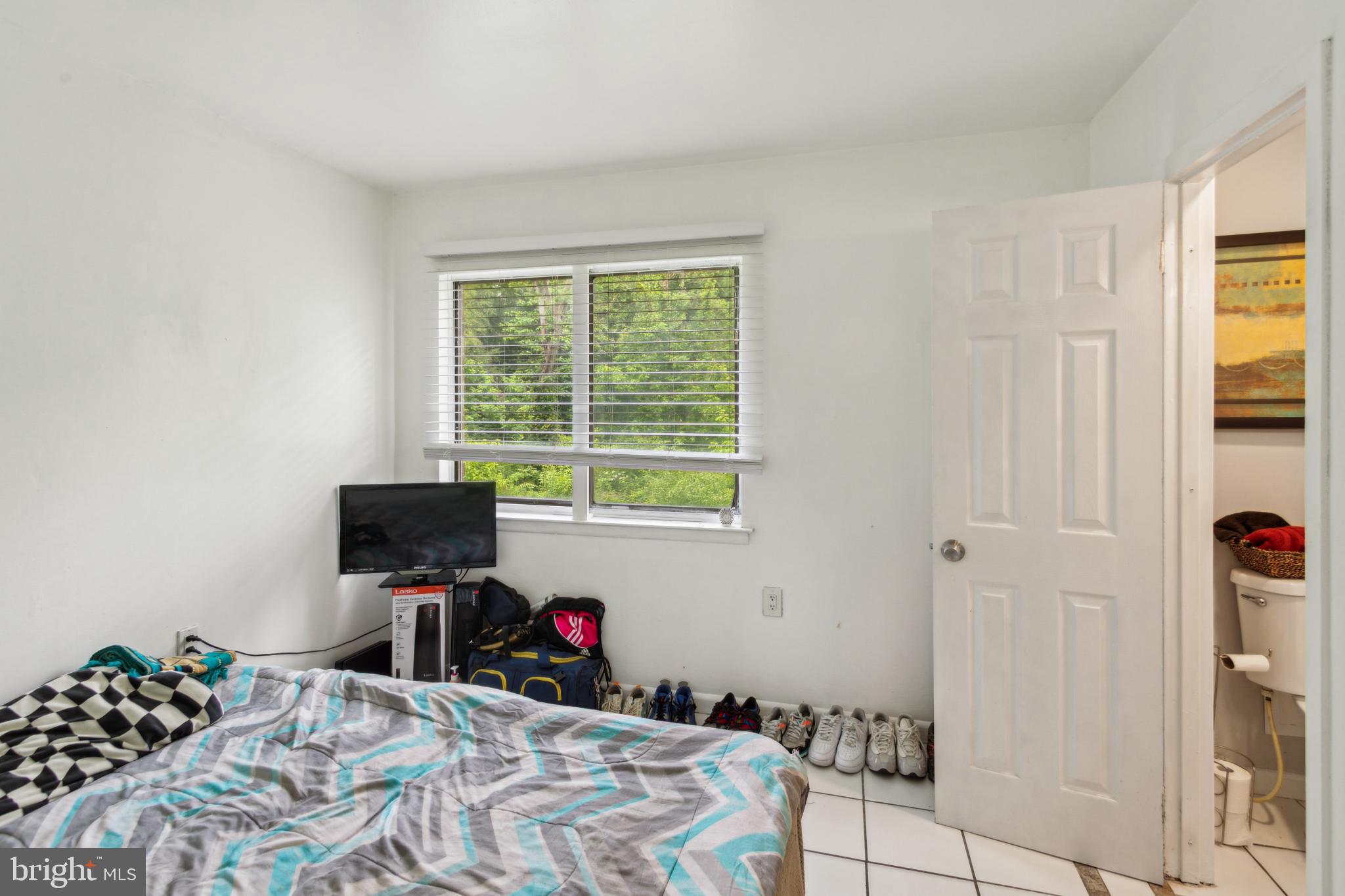 1008 Timber Creek Road Clementon, NJ 08021 - Photo 19 of 24 a bedroom with a bed and a window