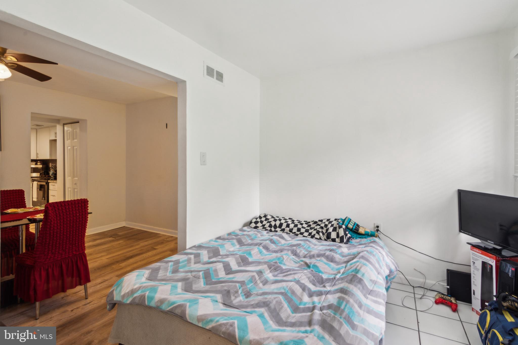 1008 Timber Creek Road Clementon, NJ 08021 - Photo 20 of 24 a bedroom with a bed and flat screen tv