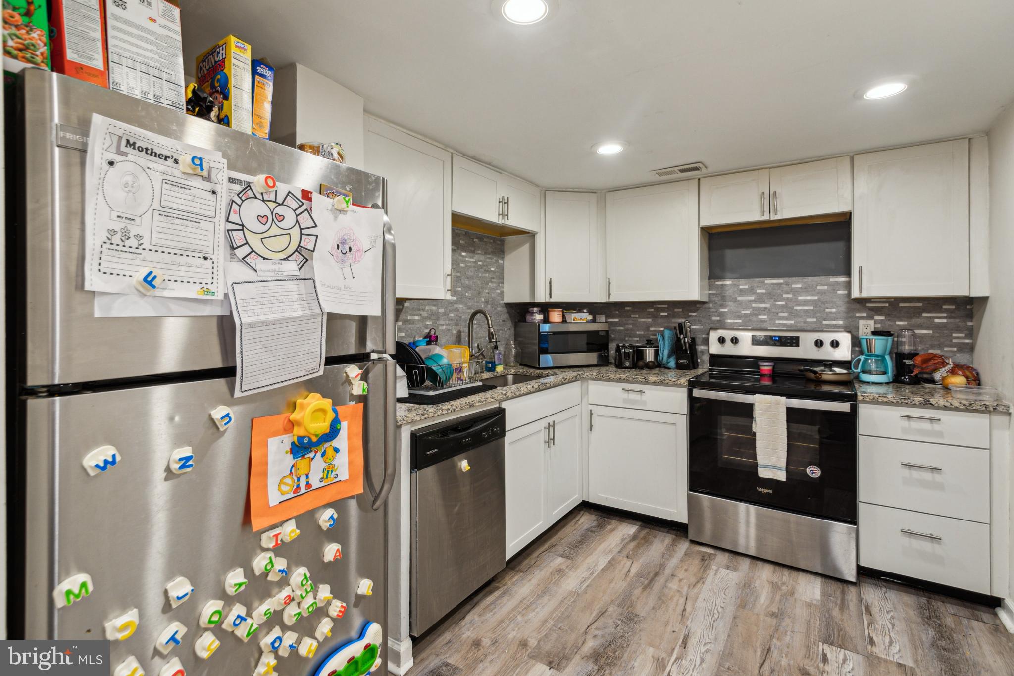 1008 Timber Creek Road Clementon, NJ 08021 - Photo 24 of 24 a kitchen with stainless steel appliances granite countertop a refrigerator sink stove and cabinets