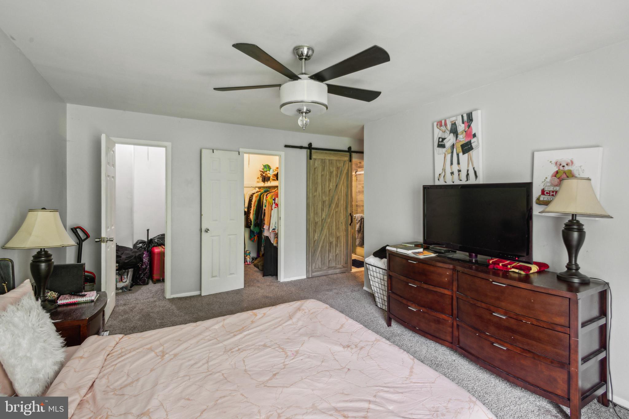 1008 Timber Creek Road Clementon, NJ 08021 - Photo 10 of 24 a bedroom with a bed and a flat screen tv