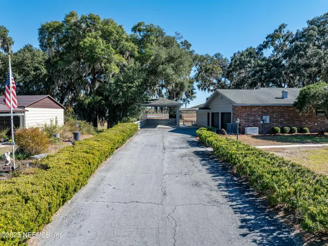 an aerial view of a house with a garden