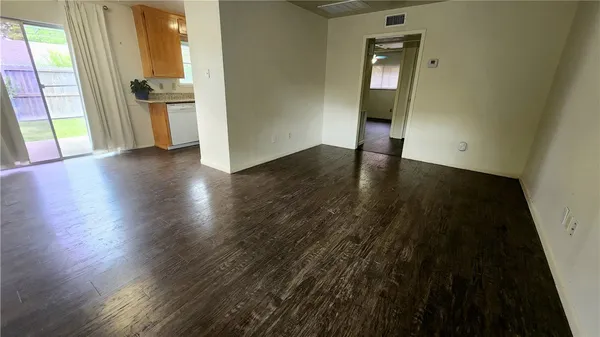 a view of a kitchen from the hallway