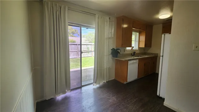 a view of a room with wooden floor and staircase