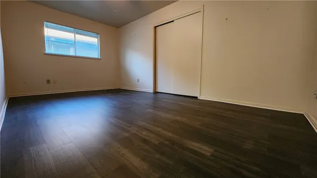 a view of a backyard with a garden and entertaining space