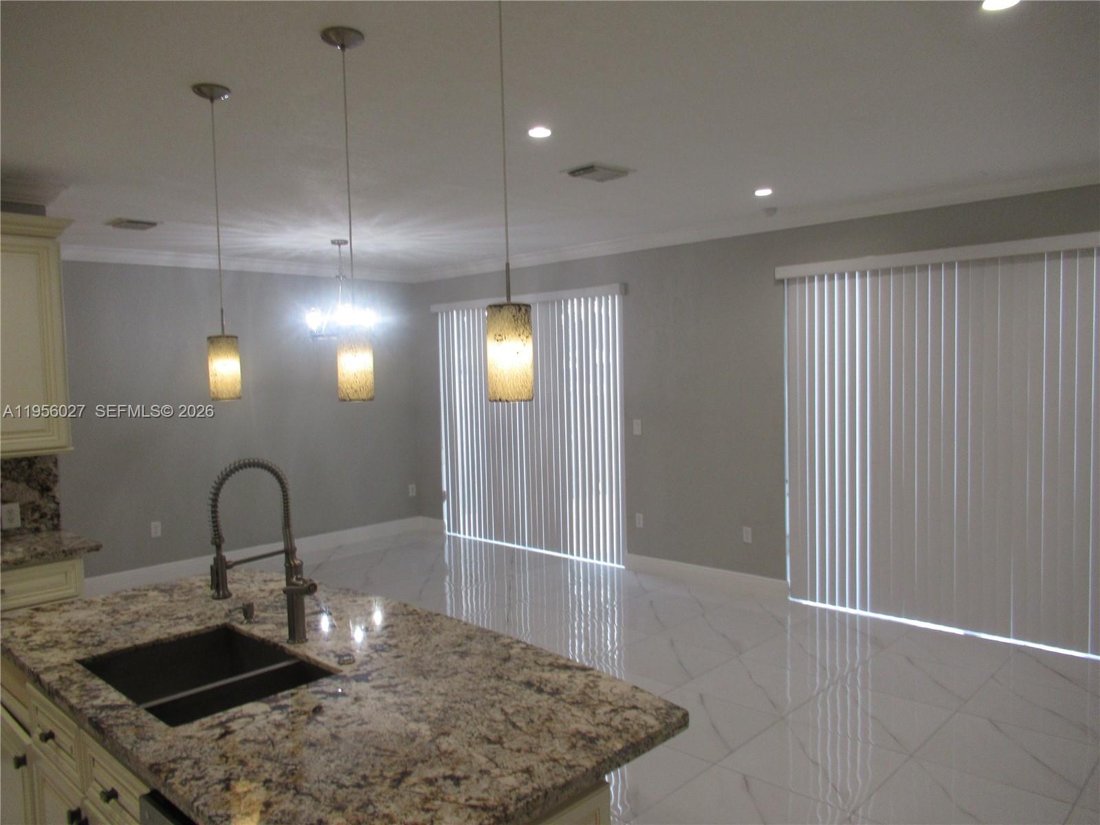 11751 Southwest 137th Place Miami, FL 33186 - Photo 8 of 25 Kitchen opens up to family room