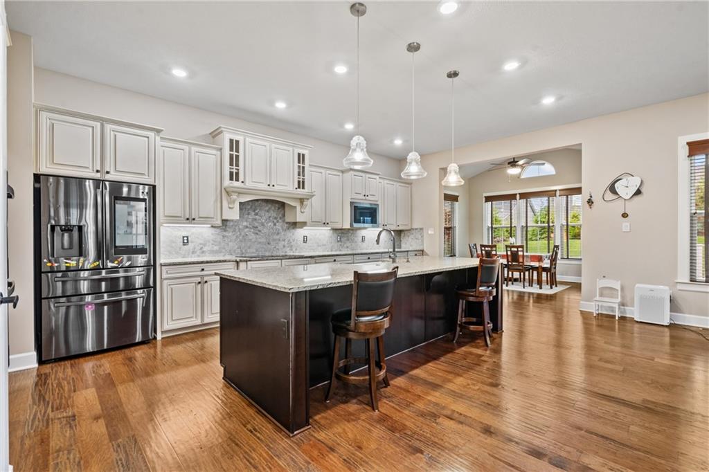 2009 Cherry Road Gibsonia, PA 15044 - Photo 14 of 45 a large kitchen with stainless steel appliances lots of counter space and wooden floor