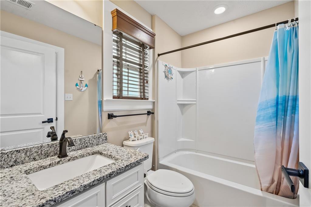 2009 Cherry Road Gibsonia, PA 15044 - Photo 28 of 45 a bathroom with a granite countertop sink toilet and shower