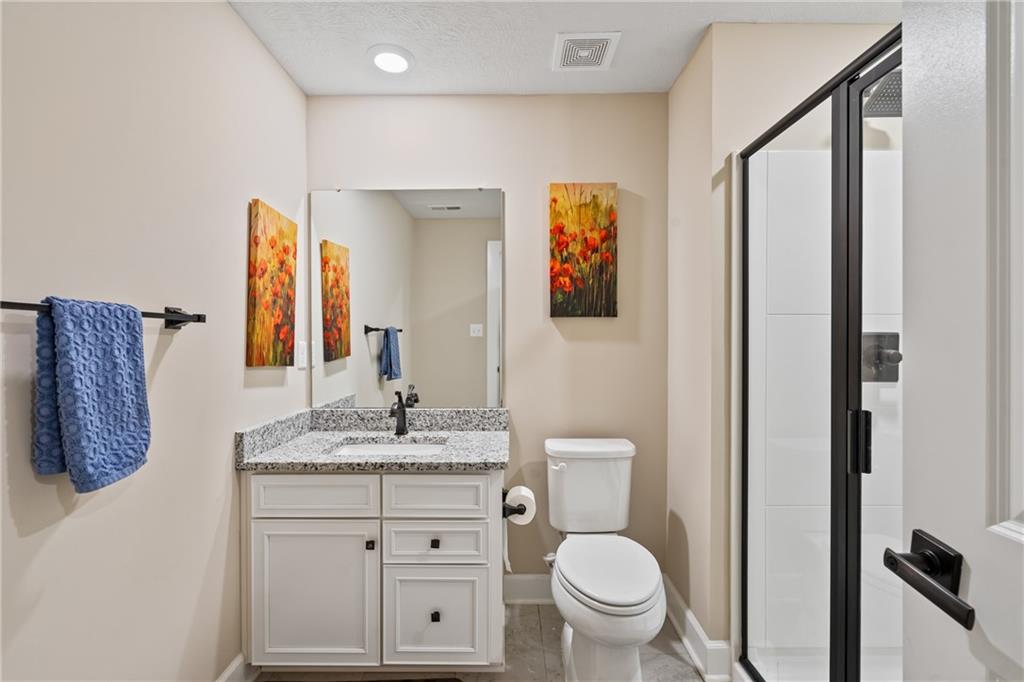2009 Cherry Road Gibsonia, PA 15044 - Photo 34 of 45 a bathroom with a granite countertop toilet sink and mirror