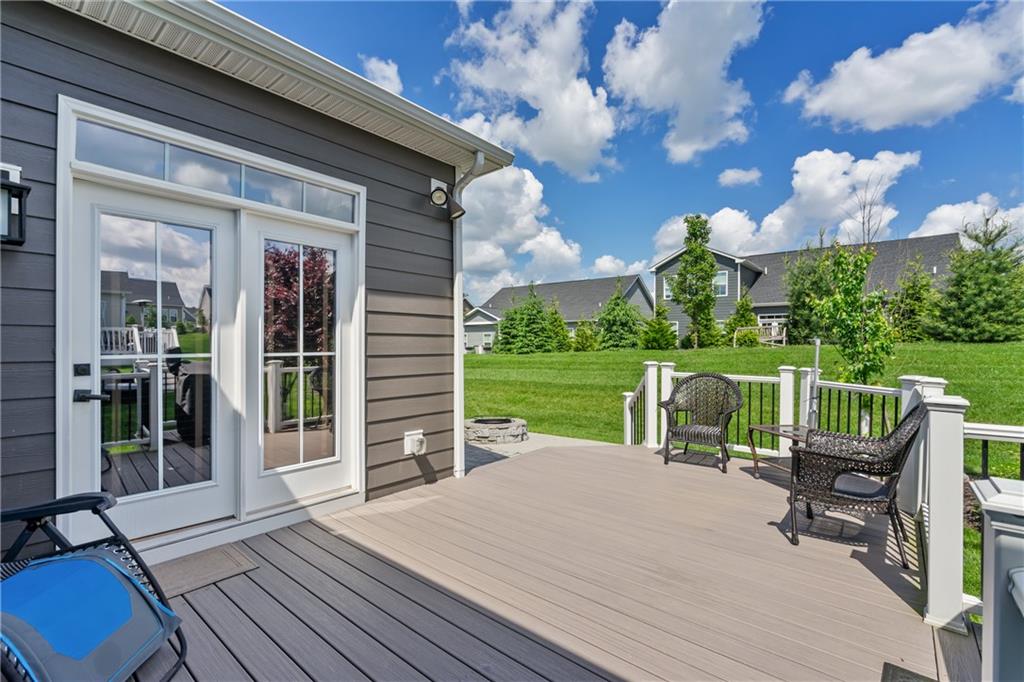2009 Cherry Road Gibsonia, PA 15044 - Photo 36 of 45 a view of a patio with table and chairs floor to ceiling window with wooden floor