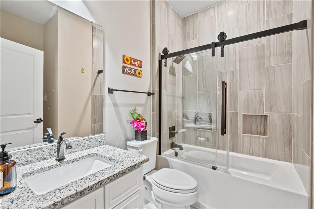 2009 Cherry Road Gibsonia, PA 15044 - Photo 7 of 45 a bathroom with a granite countertop sink mirror vanity and toilet