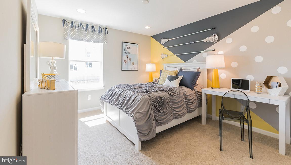 32 Georgetown Drive Freehold, NJ 07728 - Photo 14 of 37 a bedroom with a bed and a table in it