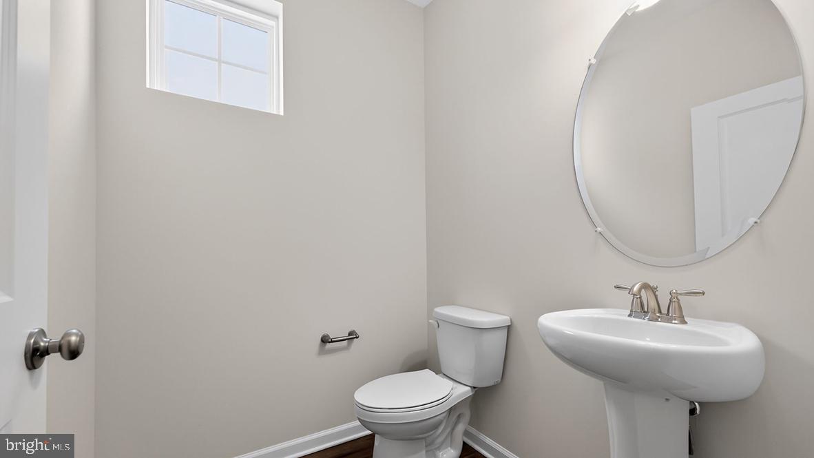 32 Georgetown Drive Freehold, NJ 07728 - Photo 31 of 37 a bathroom with a sink toilet and a mirror