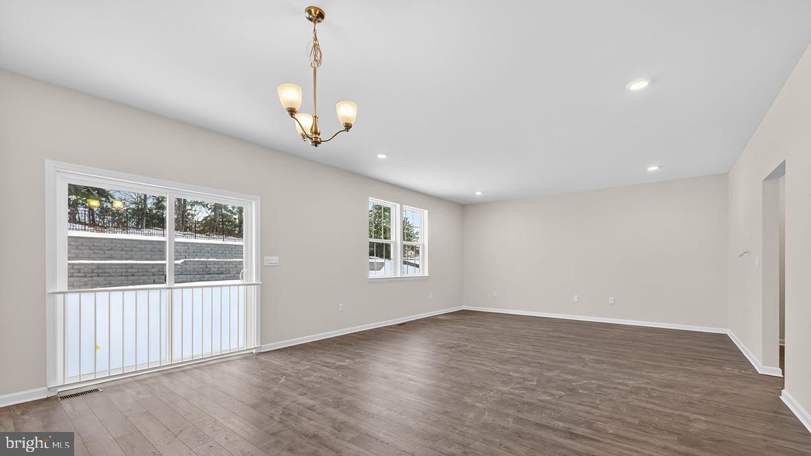 32 Georgetown Drive Freehold, NJ 07728 - Photo 33 of 37 wooden floor in an empty room with a window
