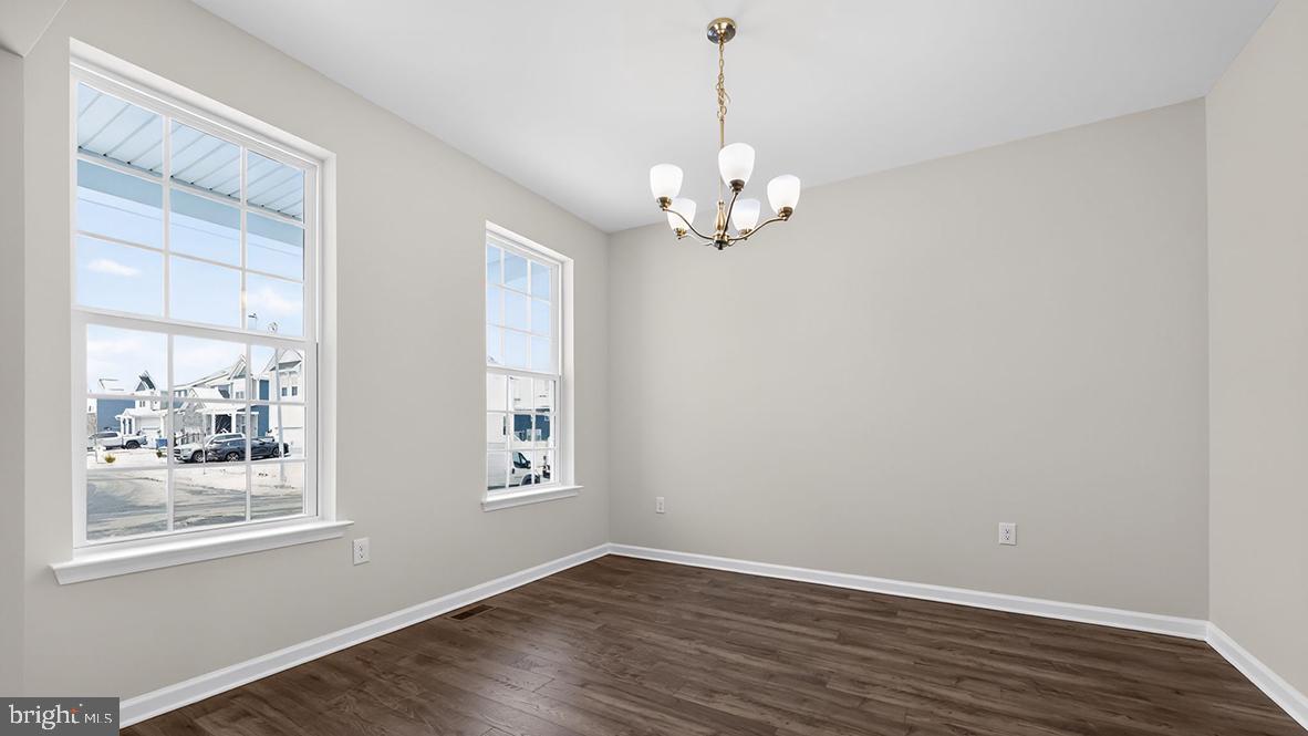 32 Georgetown Drive Freehold, NJ 07728 - Photo 34 of 37 a view of empty room with wooden floor and window