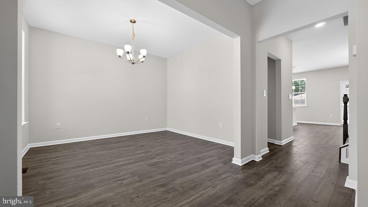 32 Georgetown Drive Freehold, NJ 07728 - Photo 35 of 37 an empty room with wooden floor and windows