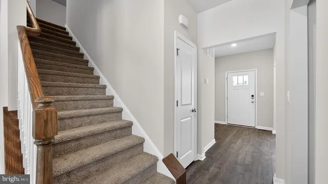 a view of an entryway with wooden floor