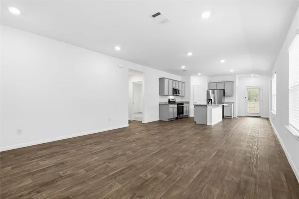 a view of kitchen with wooden floor