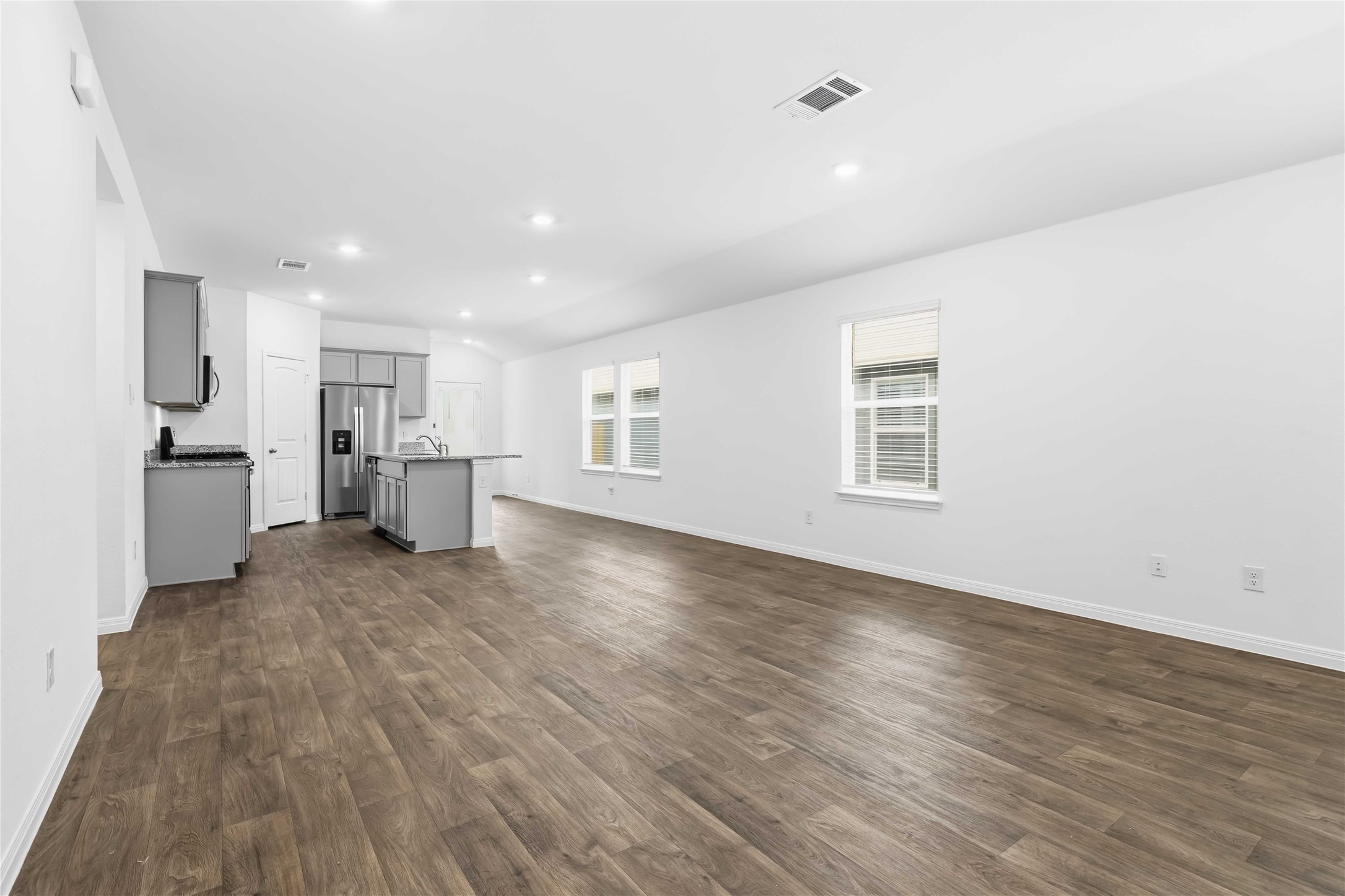 727 Gladiola Loop Kyle, TX 78640 - Photo 13 of 29 Easy maintenance wood-look luxury vinyl plank flooring runs throughout wit cozy carpeting in the bedrooms.