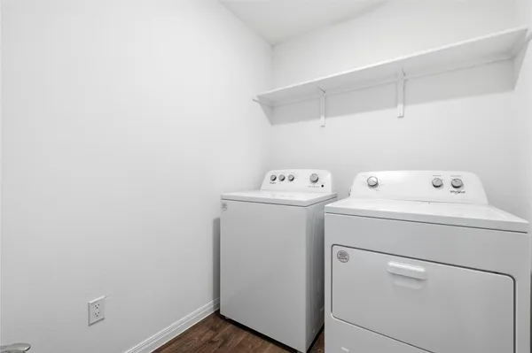 a view of storage and utility room with washer and dryer