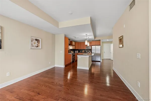 a view of kitchen with furniture and wooden floor