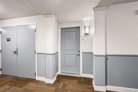 a view of a livingroom with wooden floor and closet