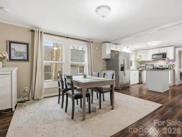 a view of a dining room with furniture and a table