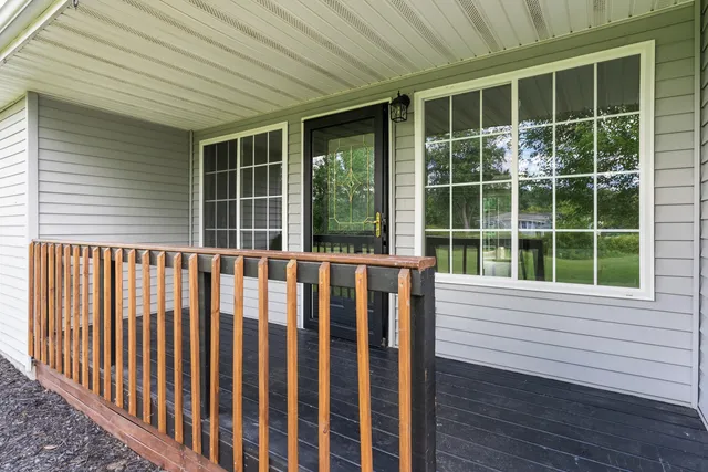 a view of a wooden house with a large window