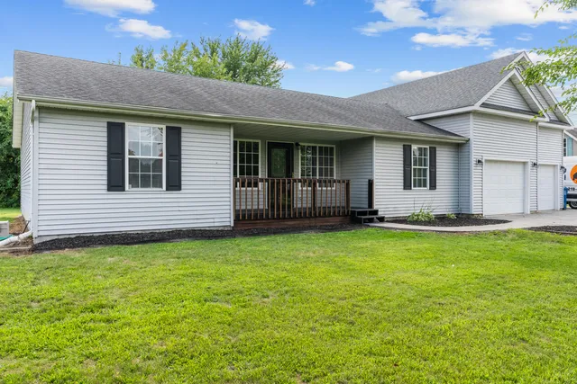 a view of a house with a garden