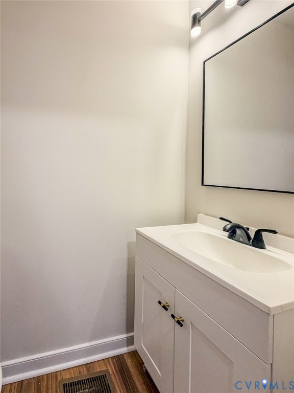 3409 Meadowbridge Road Richmond, VA 23222 - Photo 25 of 32 a bathroom with a sink and a mirror
