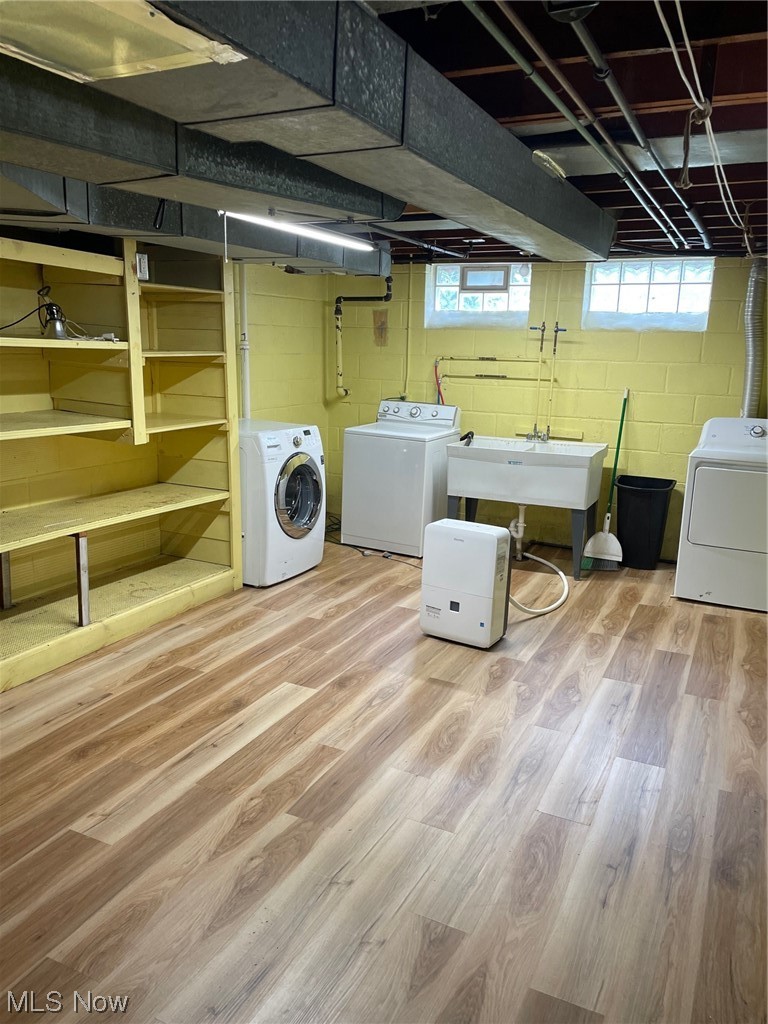 5972 Crossview Road Independence, OH 44131 - Photo 23 of 33 Washroom featuring light hardwood / wood-style floors, independent washer and dryer, and sink