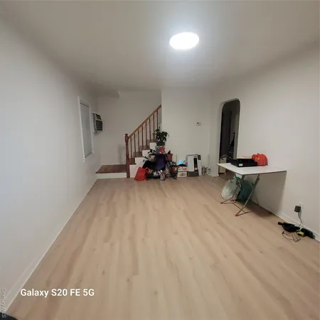 a room with gym equipment and a window