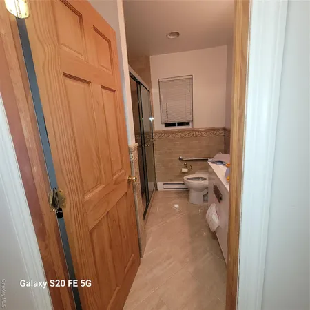 a view of a bathroom from the hallway